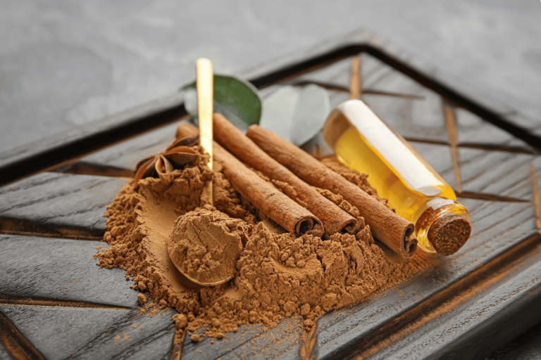 a photo of cinnamon bark and its extract in powder form and liquid extract